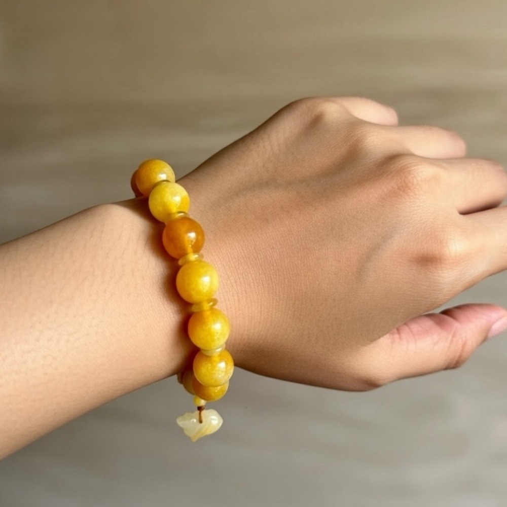 Burma Golden Imperial Jadeite Stretch Bracelet, 10mm Beads,
Length is 6”